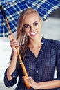 Girl under umbrella watching the rain Royalty Free Stock Photo