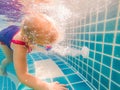 Girl and under water pool working drain close up Royalty Free Stock Photo