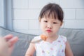 Girl with unhappy face between lunch Royalty Free Stock Photo