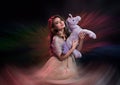 Young woman holding a unicorn toy