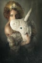 Girl with unicorn. Young woman hugging a unicorn puppet.