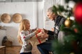 Girl unpacking christmas gift Royalty Free Stock Photo