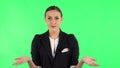 Girl is upset, waving her hands in indignation, shrugs. Green screen