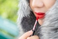 Girl use lipstick at the mouth. Fashion set sweet girl, Asian woman use lipstick. Royalty Free Stock Photo