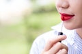 Girl use lipstick at the mouth. Fashion set sweet girl, Asian woman use lipstick. Royalty Free Stock Photo