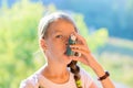 Girl using asthma inhaler Royalty Free Stock Photo