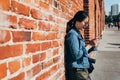 Girl using cellphone texting message online