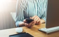 Girl using finger smartphone, woman touch on screen mobile phone in business office atmosphere or home, freelance female hands wor Royalty Free Stock Photo