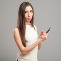 Girl using her smartphone Royalty Free Stock Photo