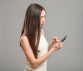 Girl using her smartphone Royalty Free Stock Photo