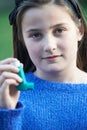 Girl Using Inhaler To Treat Asthma Attack Royalty Free Stock Photo