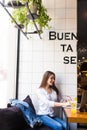 Girl using laptop and drink fresh at cafe Royalty Free Stock Photo