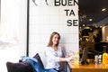 Girl using laptop and drink fresh at cafe Royalty Free Stock Photo