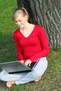 Girl using laptop outdoors Royalty Free Stock Photo