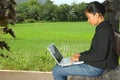 Girl Using Notebook Computer Outside