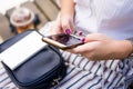 Girl using phone while charging on the power bank Royalty Free Stock Photo