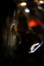 Girl using smart phone at night Royalty Free Stock Photo