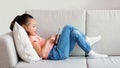 Girl Using Smartphone Playing Games Lying On Sofa Indoor, Panorama Royalty Free Stock Photo
