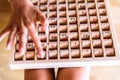 Girl using a wooden board with mathematical multiplication operations, a game to learn Royalty Free Stock Photo