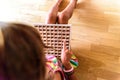 Girl using a wooden board with mathematical multiplication operations, a game to learn Royalty Free Stock Photo