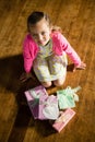 Girl with various gift boxes at home