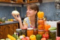 Girl with vegetables and jars Royalty Free Stock Photo