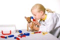 Girl Veterinarian Checking Puppy Dog's Ears