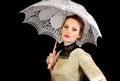 Girl in Victorian dress holding a white umbrella