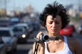 Girl with videocamera on highway