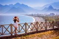 Girl viewing turquoise Antalya beaches from a terrace