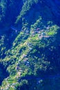 Girl at Viewpoint Eira do Serrado looking to Curral das Freiras village in the Nuns Valley in beautiful mountain scenery, Royalty Free Stock Photo