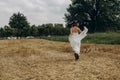 Girl village walks forged field dress hat goes Royalty Free Stock Photo