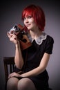 Girl with vintage camera on a chair Royalty Free Stock Photo