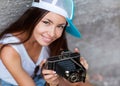 Girl with vintage retro camera.