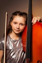 Girl with violoncello and string on gel background