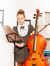 Girl with violoncello, string and musical notes Royalty Free Stock Photo