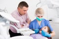 Girl visiting dentistry with father Royalty Free Stock Photo