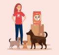 Girl volunteer with dogs and boxes with food