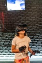 The girl in the VR helmet plays computer games Royalty Free Stock Photo