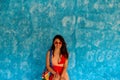 Girl waiting in front of the blue wall in Sayulita Royalty Free Stock Photo