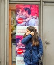 Girl waiting on the street. Top advertisement with a kissing couple