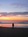 A girl waiting for sunrise on the beach Royalty Free Stock Photo