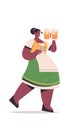 Girl waitress holding beer mugs Oktoberfest party concept african american woman in german traditional clothes Royalty Free Stock Photo