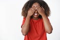 Girl waits for command to open eyes and see what surprise friend made. Portrait of excited and happy charming b-day girl Royalty Free Stock Photo