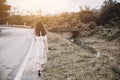 Girl walk away at roadside Royalty Free Stock Photo