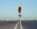 Girl walk barefoot on empty road Royalty Free Stock Photo