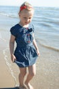 Girl walk sea shore Royalty Free Stock Photo