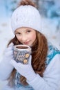 A girl on walk in the winter snow-covered park Royalty Free Stock Photo