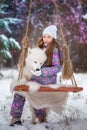 A girl on walk in the winter snow-covered park Royalty Free Stock Photo