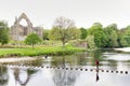 girl walking across stepping stones on a river